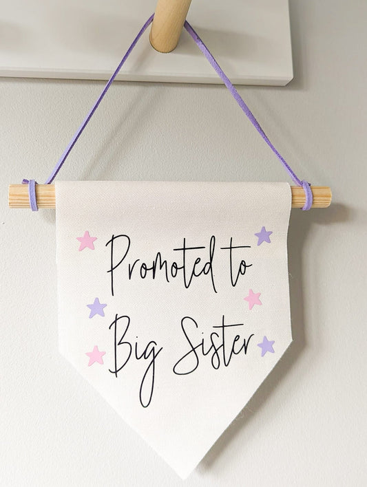 'Promoted to Big Sister' wall banner