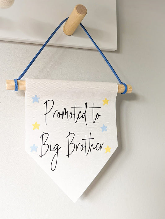 'Promoted to Big Brother' wall banner