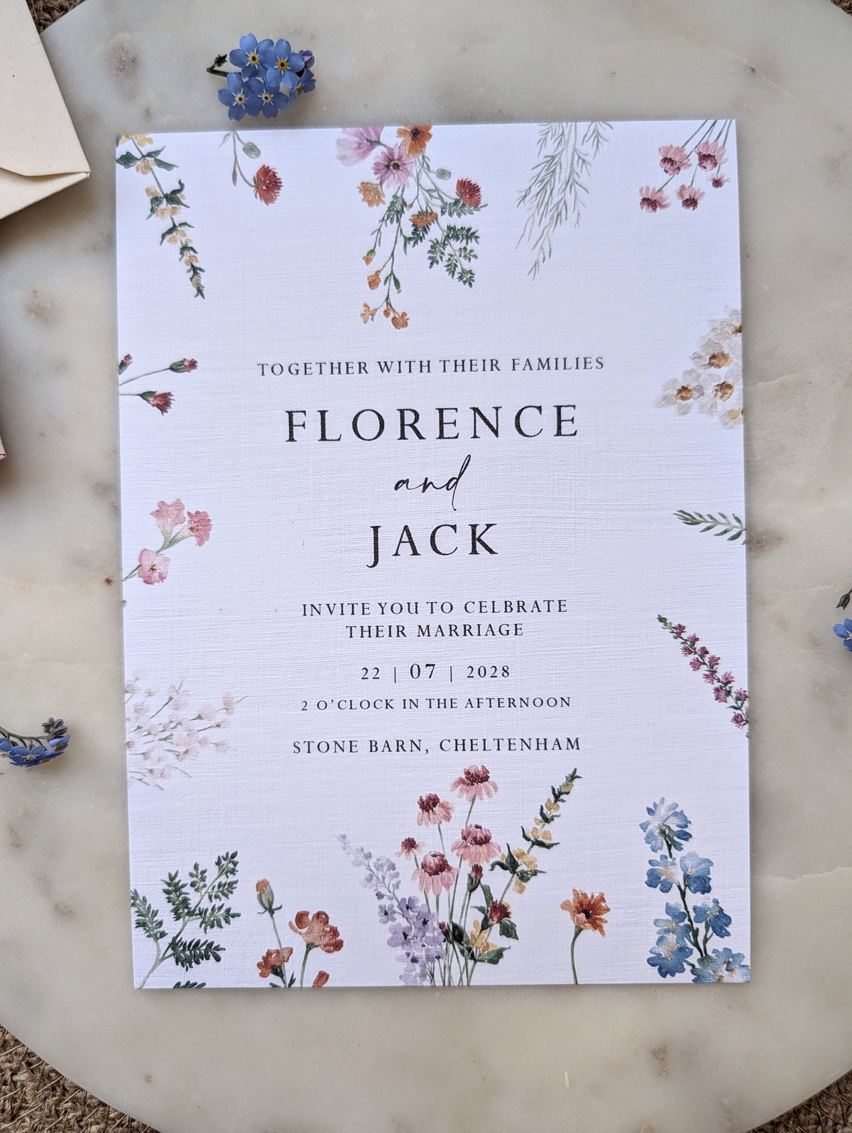 “Wildflower wedding invitation with botanical floral design”

“Floral wedding invitation suite with details and RSVP cards”

“Pastel botanical wedding stationery on linen textured card”

“Rustic floral wedding invitation with dusky pink envelope”