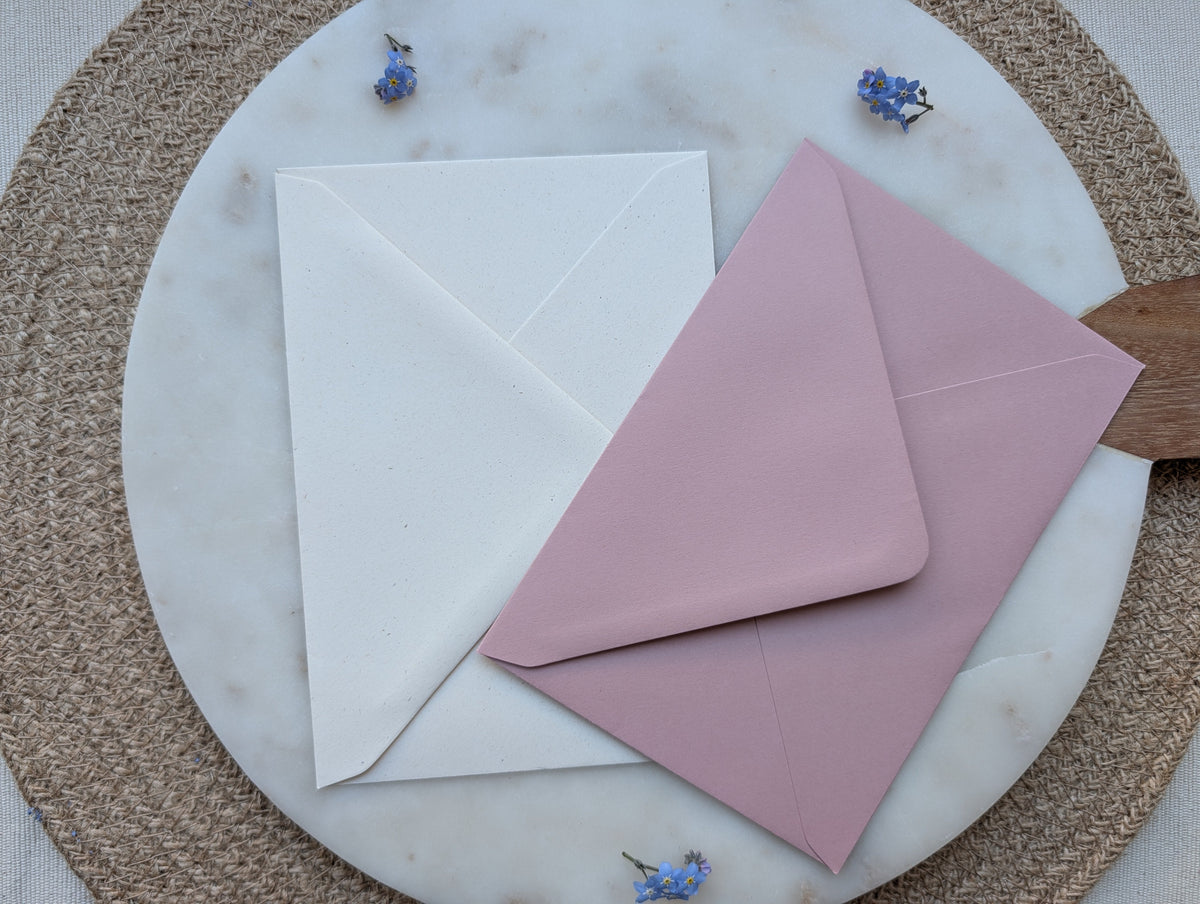 “Wildflower wedding invitation with botanical floral design”

“Floral wedding invitation suite with details and RSVP cards”

“Pastel botanical wedding stationery on linen textured card”

“Rustic floral wedding invitation with dusky pink envelope”