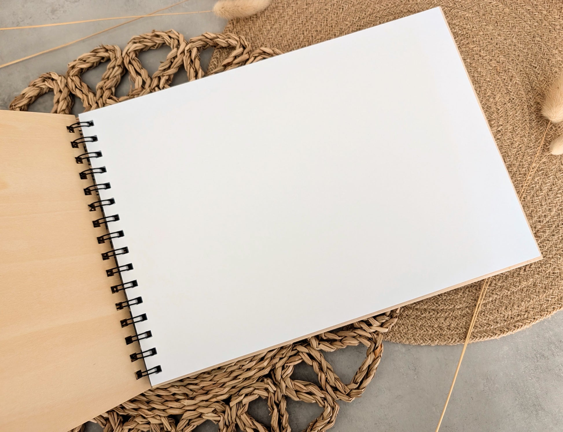 “Personalised wooden wedding guest book engraved with surname and date”

“Engraved plywood guest book with spiral binding”

“Rustic wooden wedding guest book on woven mat”

“Laser engraved basswood guest book cover”