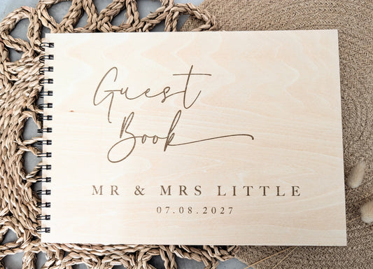 “Personalised wooden wedding guest book engraved with surname and date”

“Engraved plywood guest book with spiral binding”

“Rustic wooden wedding guest book on woven mat”

“Laser engraved basswood guest book cover”