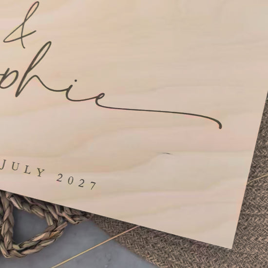 “Personalised wooden wedding guest book engraved with surname and date”

“Engraved basswood guest book with spiral binding”

“Rustic wooden wedding guest book on woven mat”