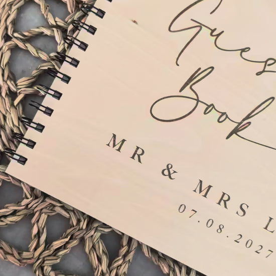 “Personalised wooden wedding guest book engraved with surname and date”

“Engraved plywood guest book with spiral binding”

“Rustic wooden wedding guest book on woven mat”

“Laser engraved basswood guest book cover”