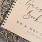 “Personalised wooden wedding guest book engraved with surname and date”

“Engraved plywood guest book with spiral binding”

“Rustic wooden wedding guest book on woven mat”

“Laser engraved basswood guest book cover”